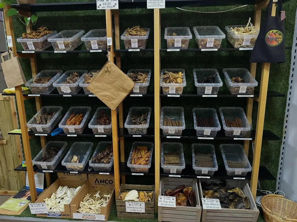 The pick ’n’ mix wall at the deli: shelves of labelled treat tubs, with crates of chews below